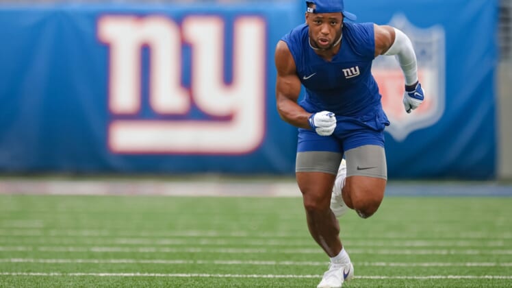 Aug 29, 2021; East Rutherford, New Jersey, USA; New York Giants running back Saquon Barkley (26) warms up before the game against the New England Patriots at MetLife Stadium. Mandatory Credit: Vincent Carchietta-USA TODAY Sports