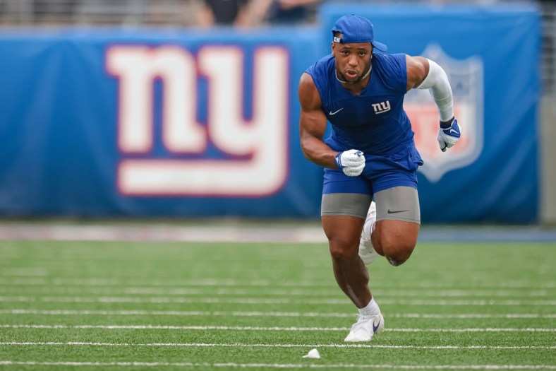 Aug 29, 2021; East Rutherford, New Jersey, USA; New York Giants running back Saquon Barkley (26) warms up before the game against the New England Patriots at MetLife Stadium. Mandatory Credit: Vincent Carchietta-USA TODAY Sports