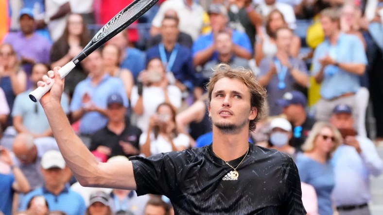 Sep 8, 2021; Flushing, NY, USA; Alexander Zverev of Germany hits to Lloyd Harris of South Africa on day ten of the 2021 U.S. Open tennis tournament at USTA Billie Jean King National Tennis Center. Mandatory Credit: Robert Deutsch-USA TODAY Sports