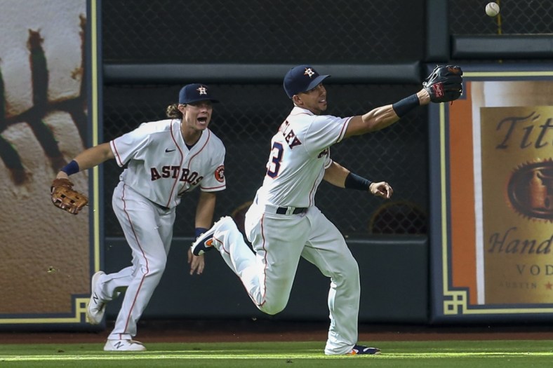 Sep 8, 2021; Houston, Texas, USA; Houston Astros left fielder Michael Brantley (23) and  center fielder Jake Meyers (6) try to field Seattle Mariners center fielder Jarred Kelenic (10) (not pictured) double in the seventh inning at Minute Maid Park. Mandatory Credit: Thomas Shea-USA TODAY Sports