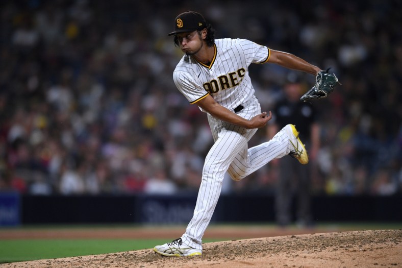 Sep 8, 2021; San Diego, California, USA; San Diego Padres starting pitcher Yu Darvish (11) throws a pitch against the Los Angeles Angels during the sixth inning at Petco Park. Mandatory Credit: Orlando Ramirez-USA TODAY Sports