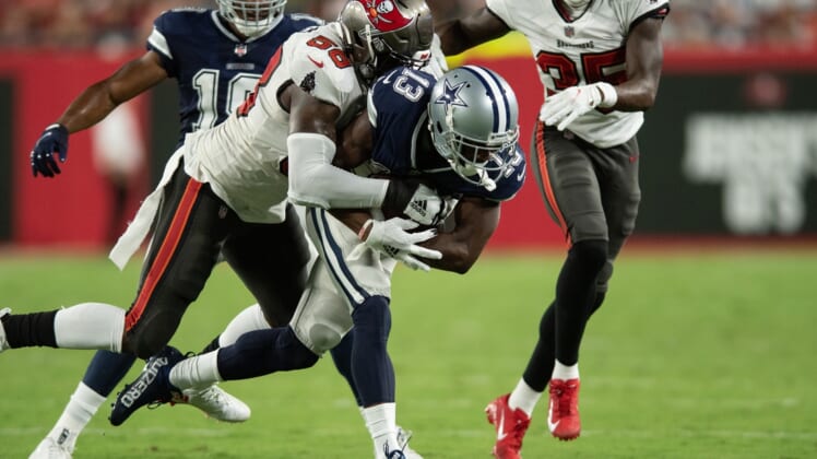 Sep 9, 2021; Tampa, Florida, USA; Tampa Bay Buccaneers line backer Shaquil Barrett (58) tackles Dallas Cowboys wide receiver Michael Gallup (13) in the second quarter at Raymond James Stadium. Mandatory Credit: Jeremy Reper-USA TODAY Sports