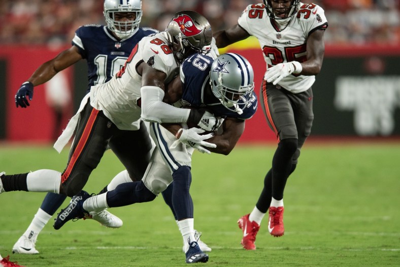 Sep 9, 2021; Tampa, Florida, USA; Tampa Bay Buccaneers line backer Shaquil Barrett (58) tackles Dallas Cowboys wide receiver Michael Gallup (13) in the second quarter at Raymond James Stadium. Mandatory Credit: Jeremy Reper-USA TODAY Sports