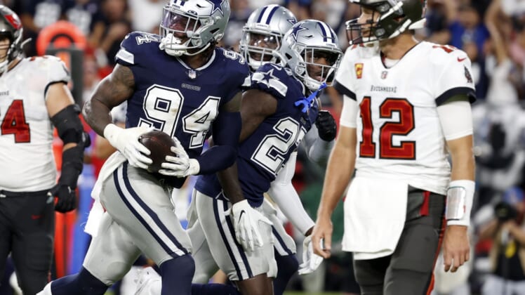 Sep 9, 2021; Tampa, Florida, USA; Dallas Cowboys defensive end Randy Gregory (94) reacts after recovering the ball against the Tampa Bay Buccaneers during the first half at Raymond James Stadium. Mandatory Credit: Kim Klement-USA TODAY Sports