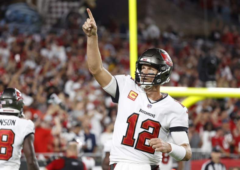 Sep 9, 2021; Tampa, Florida, USA; Tampa Bay Buccaneers quarterback Tom Brady (12) celebrates after a Buccaneers touchdown  against the Dallas Cowboys during the first half at Raymond James Stadium. Mandatory Credit: Kim Klement-USA TODAY Sports
