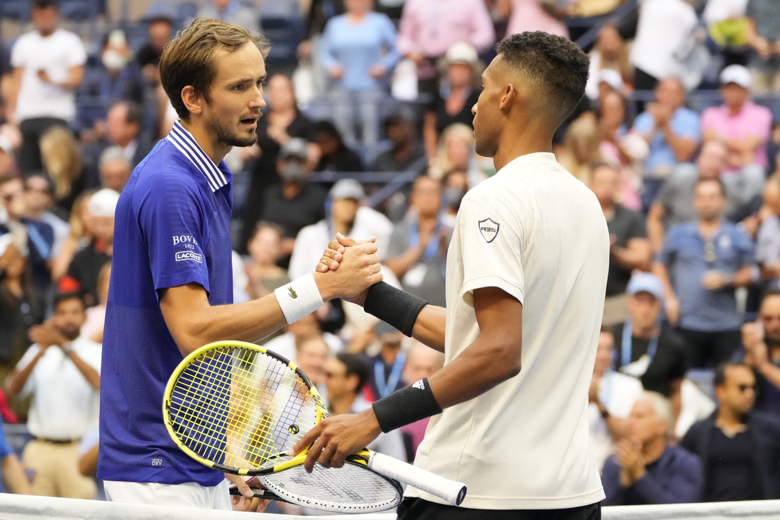 Sep 10, 2021; Flushing, NY, USA; Daniil Medvedev of Russia (L) shakes hands with Felix Auger-Aliassime of Canada (R) after their match on day twelve of the 2021 U.S. Open tennis tournament at USTA Billie Jean King National Tennis Center. Mandatory Credit: Robert Deutsch-USA TODAY Sports