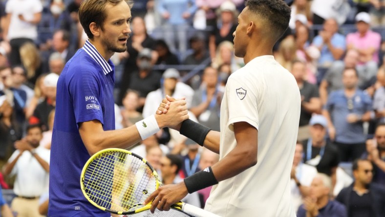 Sep 10, 2021; Flushing, NY, USA; Daniil Medvedev of Russia (L) shakes hands with Felix Auger-Aliassime of Canada (R) after their match on day twelve of the 2021 U.S. Open tennis tournament at USTA Billie Jean King National Tennis Center. Mandatory Credit: Robert Deutsch-USA TODAY Sports