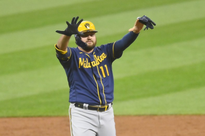 Sep 10, 2021; Cleveland, Ohio, USA; Milwaukee Brewers first baseman Rowdy Tellez (11) celebrates his double in the second inning against the Cleveland Indians at Progressive Field. Mandatory Credit: David Richard-USA TODAY Sports