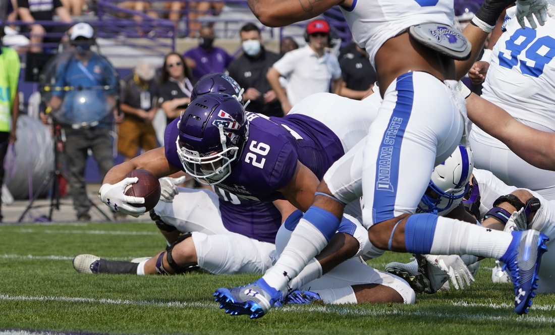 Sep 11, 2021; Evanston, Illinois, USA; Northwestern Wildcats running back Evan Hull (26) scores a touchdown against the Indiana State Sycamores during the first half at Ryan Field. Mandatory Credit: David Banks-USA TODAY Sports