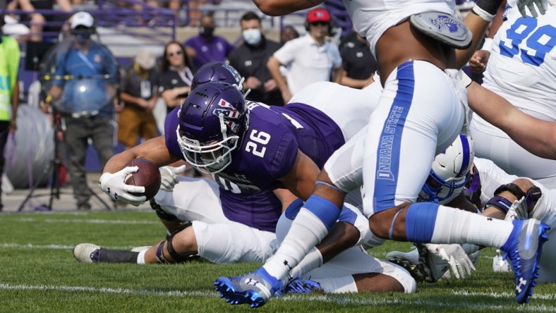 Sep 11, 2021; Evanston, Illinois, USA; Northwestern Wildcats running back Evan Hull (26) scores a touchdown against the Indiana State Sycamores during the first half at Ryan Field. Mandatory Credit: David Banks-USA TODAY Sports