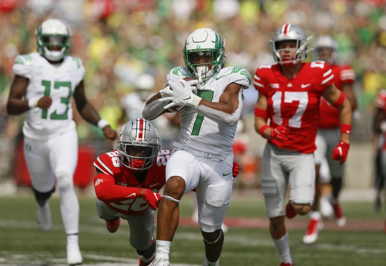 Oregon running back CJ Verdell runs past Ohio State  safety Bryson Shaw (17) and cornerback Cameron Brown (26) for a 77-yard touchdown on Saturday. Verdell scored two touchdowns.

Oregon CP