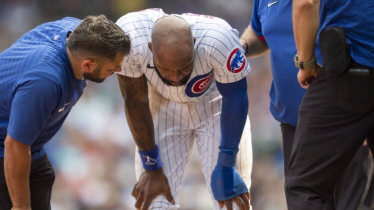 Sep 11, 2021; Chicago, Illinois, USA; Chicago Cubs right fielder Jason Heyward (22) reacts after an injury from sliding into third base during the fourth inning against the San Francisco Giants at Wrigley Field. Mandatory Credit: Patrick Gorski-USA TODAY Sports