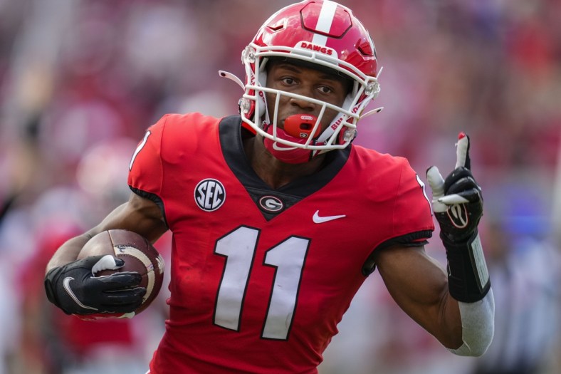 Sep 11, 2021; Athens, Georgia, USA; Georgia Bulldogs wide receiver Arian Smith (11) reacts as he scores a touchdown after catching a pass against the UAB Blazers during the first half at Sanford Stadium. Mandatory Credit: Dale Zanine-USA TODAY Sports