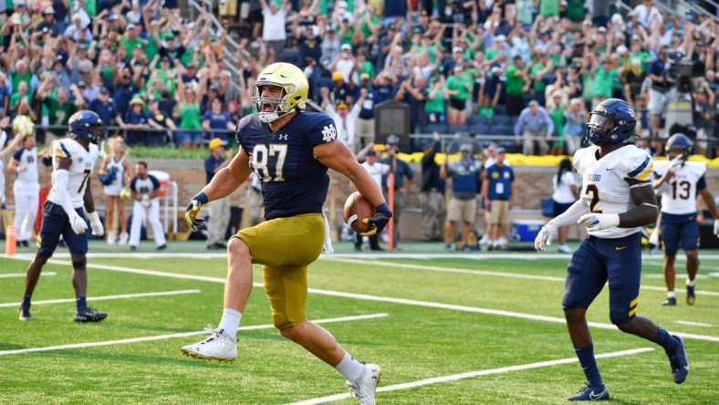 Sep 11, 2021; South Bend, Indiana, USA; Notre Dame Fighting Irish tight end Michael Mayer (87) scores in the fourth quarter against the Toledo Rockets at Notre Dame Stadium. Mandatory Credit: Matt Cashore-USA TODAY Sports