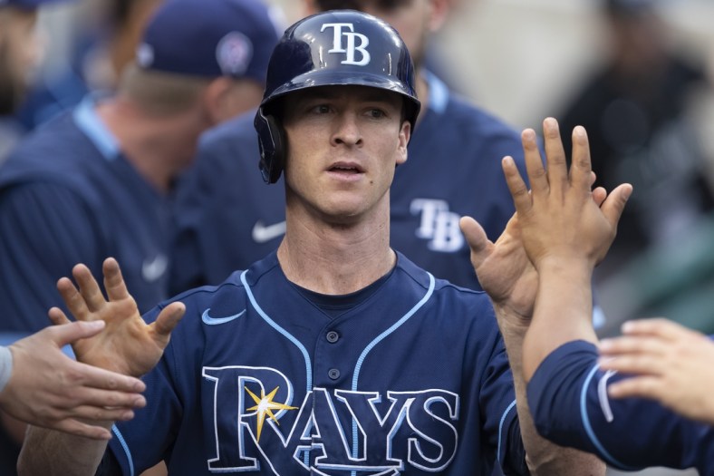 Sep 11, 2021; Detroit, Michigan, USA; Tampa Bay Rays third baseman Joey Wendle (18) celebrates with teammates in the dugout after scoring a run during the second inning against the Detroit Tigers at Comerica Park. Mandatory Credit: Raj Mehta-USA TODAY Sports