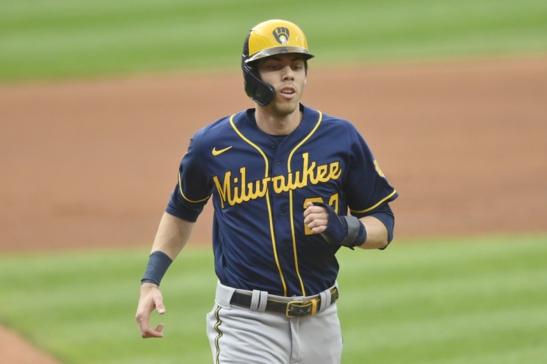 Sep 11, 2021; Cleveland, Ohio, USA; Milwaukee Brewers left fielder Christian Yelich (22) scores in the first inning against the Cleveland Indians at Progressive Field. Mandatory Credit: David Richard-USA TODAY Sports