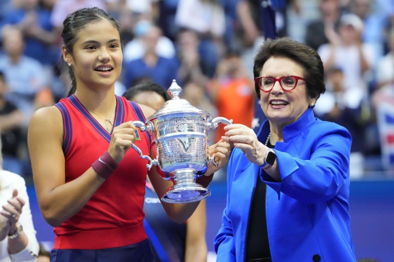 Sep 11, 2021; Flushing, NY, USA; Emma Raducanu of Great Britain (L) is presented the championship trophy by Billie Jean King (R) after her match against Leylah Fernandez of Canada (not pictured) in the women's singles final on day thirteen of the 2021 U.S. Open tennis tournament at USTA Billie Jean King National Tennis Center. Mandatory Credit: Robert Deutsch-USA TODAY Sports