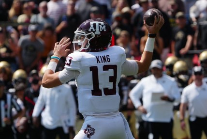 Sep 11, 2021; Denver, Colorado, USA; Texas A&M Aggies quarterback Haynes King (13) prepares to pass the ball in the first quarter against the Colorado Buffaloes at Empower Field at Mile High. Mandatory Credit: Ron Chenoy-USA TODAY Sports