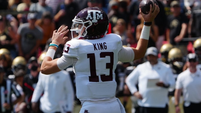 Sep 11, 2021; Denver, Colorado, USA; Texas A&M Aggies quarterback Haynes King (13) prepares to pass the ball in the first quarter against the Colorado Buffaloes at Empower Field at Mile High. Mandatory Credit: Ron Chenoy-USA TODAY Sports