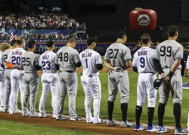 Sep 11, 2021; New York City, New York, USA;  Members of the New York Yankees and New York Mets line up next to each other during the September 11 pre-game ceremonies at Citi Field. Mandatory Credit: Wendell Cruz-USA TODAY Sports