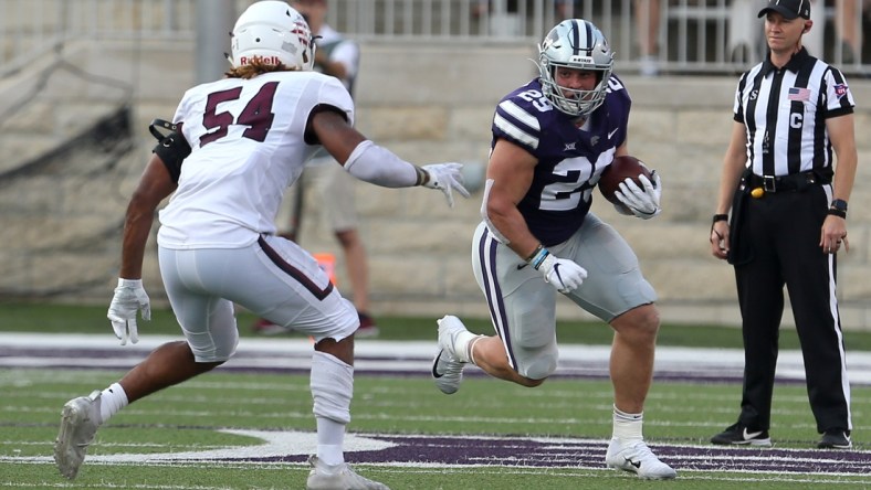 Sep 11, 2021; Manhattan, Kansas, USA; Kansas State Wildcats fullback Jax Dineen (29) looks for room to run against Southern Illinois Salukis linebacker Bryce Notree (54) during a game at Bill Snyder Family Football Stadium. Mandatory Credit: Scott Sewell-USA TODAY Sports