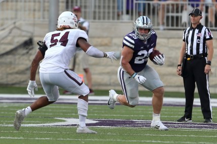 Sep 11, 2021; Manhattan, Kansas, USA; Kansas State Wildcats fullback Jax Dineen (29) looks for room to run against Southern Illinois Salukis linebacker Bryce Notree (54) during a game at Bill Snyder Family Football Stadium. Mandatory Credit: Scott Sewell-USA TODAY Sports