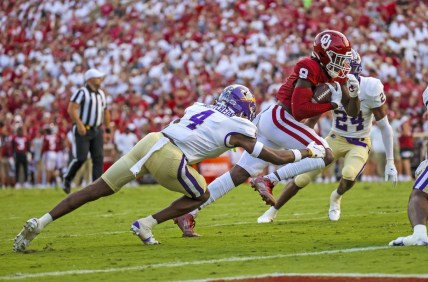 Sep 11, 2021; Norman, Oklahoma, USA; Oklahoma Sooners wide receiver Michael Woods II (8) scores a touchdown past Western Carolina Catamounts defensive back Cameron McCutcheon (4) during the second quarter at Gaylord Family-Oklahoma Memorial Stadium. Mandatory Credit: Kevin Jairaj-USA TODAY Sports