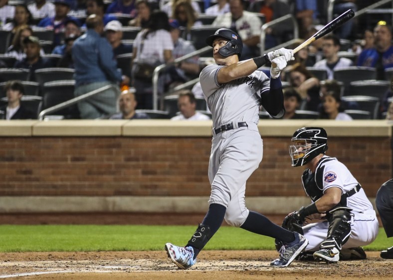Sep 11, 2021; New York City, New York, USA;  New York Yankees right fielder Aaron Judge (99) hits a solo home run in the second inning against the New York Mets at Citi Field. Mandatory Credit: Wendell Cruz-USA TODAY Sports