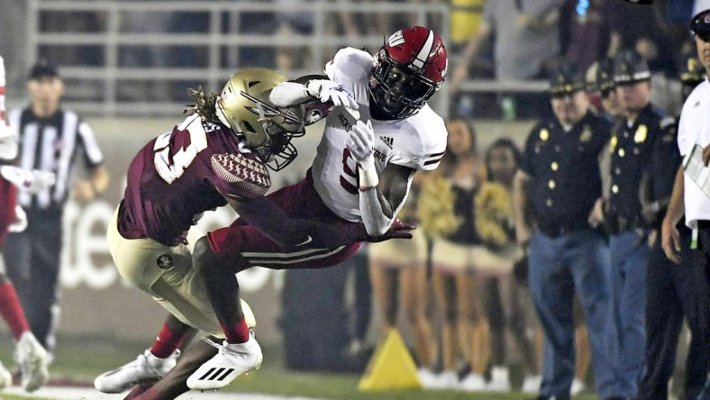 Sep 11, 2021; Tallahassee, Florida, USA; Florida State Seminoles defensive back Sidney Wiliams (23) knocks the ball loose from Jacksonville State Gamecocks wide receiver Ahmad Edwards (9) during the first quarter at Doak S. Campbell Stadium. Mandatory Credit: Melina Myers-USA TODAY Sports