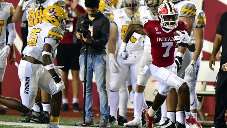 Sep 11, 2021; Bloomington, Indiana, USA; Indiana Hoosiers wide receiver D.J. Matthews Jr. (7) runs the ball to the end zone on a kickoff against the Idaho Vandals during the second quarter at Memorial Stadium. Mandatory Credit: Marc Lebryk-USA TODAY Sports