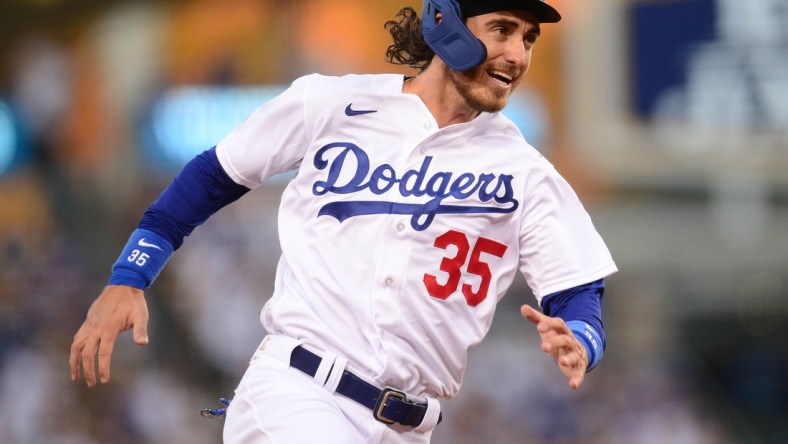 September 11, 2021; Los Angeles, California, USA; Los Angeles Dodgers center fielder Cody Bellinger (35) rounds third to score against the San Diego Padres during the third inning at Dodger Stadium. Mandatory Credit: Gary A. Vasquez-USA TODAY Sports