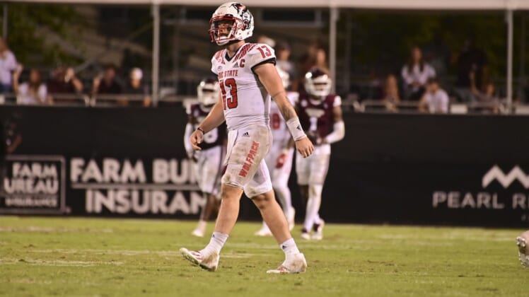 Sep 11, 2021; Starkville, Mississippi, USA; North Carolina State Wolfpack quarterback Devin Leary (13) reacts during the fourth quarter against the Mississippi State Bulldogs at Davis Wade Stadium at Scott Field. Mandatory Credit: Matt Bush-USA TODAY Sports
