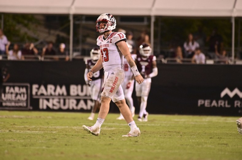 Sep 11, 2021; Starkville, Mississippi, USA; North Carolina State Wolfpack quarterback Devin Leary (13) reacts during the fourth quarter against the Mississippi State Bulldogs at Davis Wade Stadium at Scott Field. Mandatory Credit: Matt Bush-USA TODAY Sports