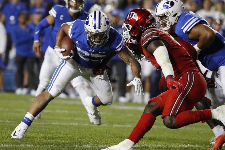 Sep 11, 2021; Provo, Utah, USA; Brigham Young Cougars running back Tyler Allgeier (25) runs the ball in the second quarter against the Utah Utes at LaVell Edwards Stadium. Mandatory Credit: Jeffrey Swinger-USA TODAY Sports