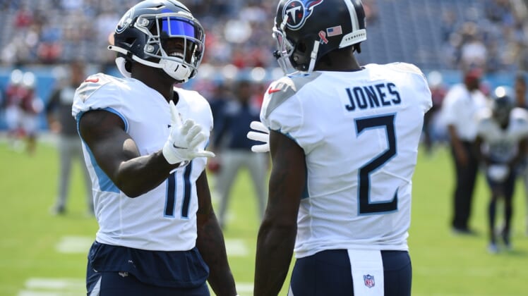 Sep 12, 2021; Nashville, Tennessee, USA; Tennessee Titans wide receiver A.J. Brown (11) and Tennessee Titans wide receiver Julio Jones (2) before the game against the Arizona Cardinals at Nissan Stadium. Mandatory Credit: Christopher Hanewinckel-USA TODAY Sports