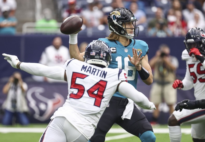 Sep 12, 2021; Houston, Texas, USA; Jacksonville Jaguars quarterback Trevor Lawrence (16) attempts a pass during the first quarter against the Houston Texans at NRG Stadium. Mandatory Credit: Troy Taormina-USA TODAY Sports