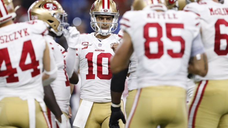 Sep 12, 2021; Detroit, Michigan, USA; San Francisco 49ers quarterback Jimmy Garoppolo (10) huddles with teammates during the first quarter against the Detroit Lions at Ford Field. Mandatory Credit: Raj Mehta-USA TODAY Sports