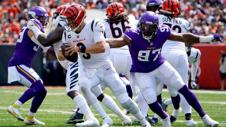 Cincinnati Bengals quarterback Joe Burrow (9) evades pressure by Minnesota Vikings defensive end Everson Griffen (97) in the second quarter during an NFL Week 1 football game, Sunday, Sept. 12, 2021, at Paul Brown Stadium in CincinnatiMinnesota Vikings At Cincinnati Bengals Sept 12