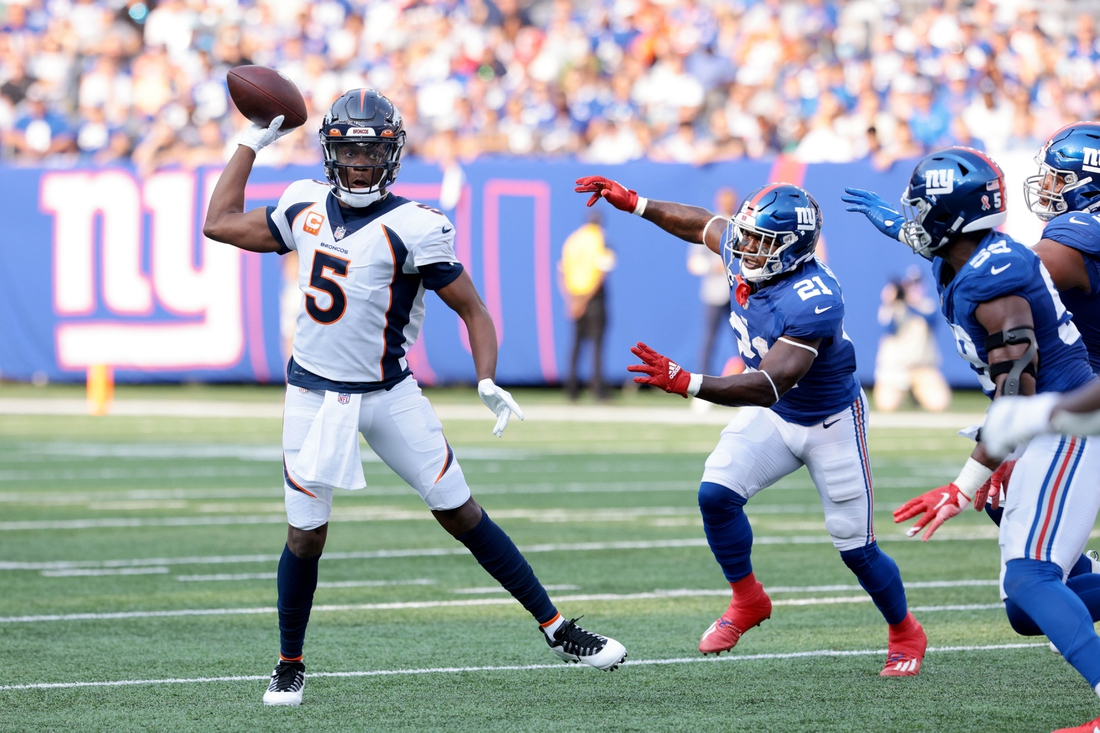 Sep 12, 2021; East Rutherford, New Jersey, USA; Denver Broncos quarterback Teddy Bridgewater (5) throws the ball against the New York Giants during the first quarter at MetLife Stadium. Mandatory Credit: Vincent Carchietta-USA TODAY Sports