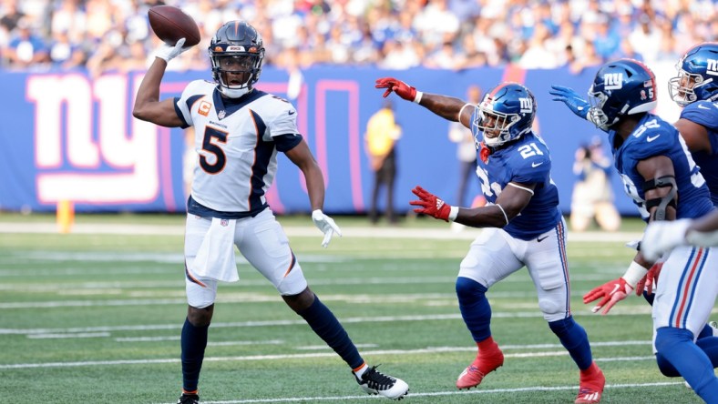 Sep 12, 2021; East Rutherford, New Jersey, USA; Denver Broncos quarterback Teddy Bridgewater (5) throws the ball against the New York Giants during the first quarter at MetLife Stadium. Mandatory Credit: Vincent Carchietta-USA TODAY Sports