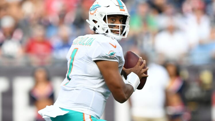 Sep 12, 2021; Foxborough, Massachusetts, USA; Miami Dolphins quarterback Tua Tagovailoa (1) looks to pass against the New England Patriots during the first half at Gillette Stadium. Mandatory Credit: Brian Fluharty-USA TODAY Sports