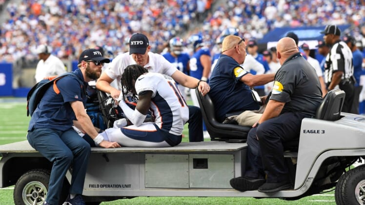 Sep 12, 2021; East Rutherford, New Jersey, USA;  Denver Broncos wide receiver Jerry Jeudy (10) is taken off the field after being injured in the game against the New York Giants during the second half at MetLife Stadium. Mandatory Credit: Dennis Schneidler-USA TODAY Sports