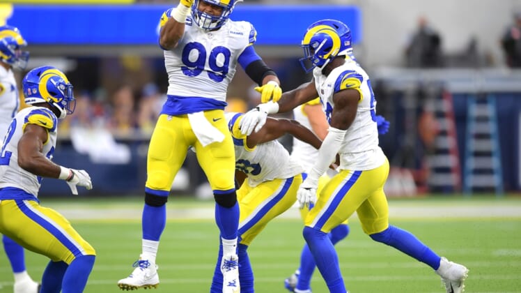 Sep 12, 2021; Inglewood, California, USA;  Los Angeles Rams defensive end Aaron Donald (99) celebrates after a fumble against the Chicago Bears in the first half of the game at SoFi Stadium. Mandatory Credit: Jayne Kamin-Oncea-USA TODAY Sports