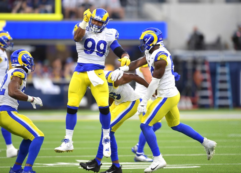 Sep 12, 2021; Inglewood, California, USA;  Los Angeles Rams defensive end Aaron Donald (99) celebrates after a fumble against the Chicago Bears in the first half of the game at SoFi Stadium. Mandatory Credit: Jayne Kamin-Oncea-USA TODAY Sports