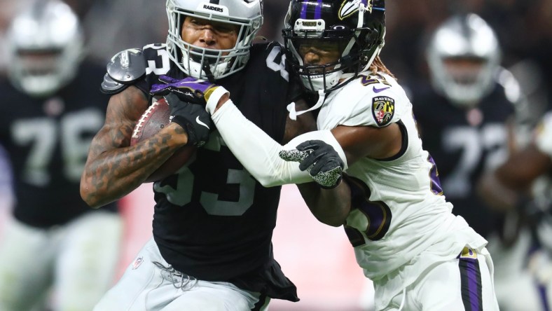 Sep 13, 2021; Paradise, Nevada, USA; Las Vegas Raiders tight end Darren Waller (83) runs the ball against Baltimore Ravens cornerback Anthony Averett (23) during the second half at Allegiant Stadium. Mandatory Credit: Mark J. Rebilas-USA TODAY Sports