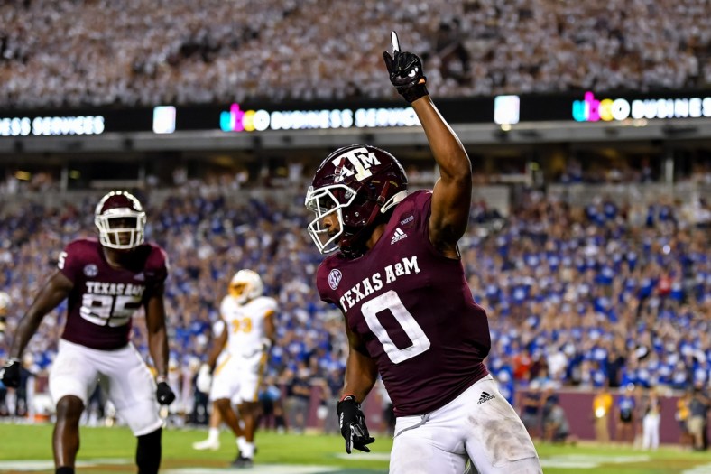 Sep 4, 2021;  College Station, Texas, USA;  Texas A&M Aggies wide receiver Ainias Smith (0) reacts after his touchdown in the fourth quarter against the Kent State Golden Flashes at Kyle Field. Mandatory Credit: Maria Lysaker-USA TODAY Sports