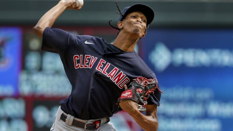 Sep 14, 2021; Minneapolis, Minnesota, USA; Cleveland Indians starting pitcher Triston McKenzie (24) throws to the Minnesota Twins in the second inning at Target Field. Mandatory Credit: Bruce Kluckhohn-USA TODAY Sports