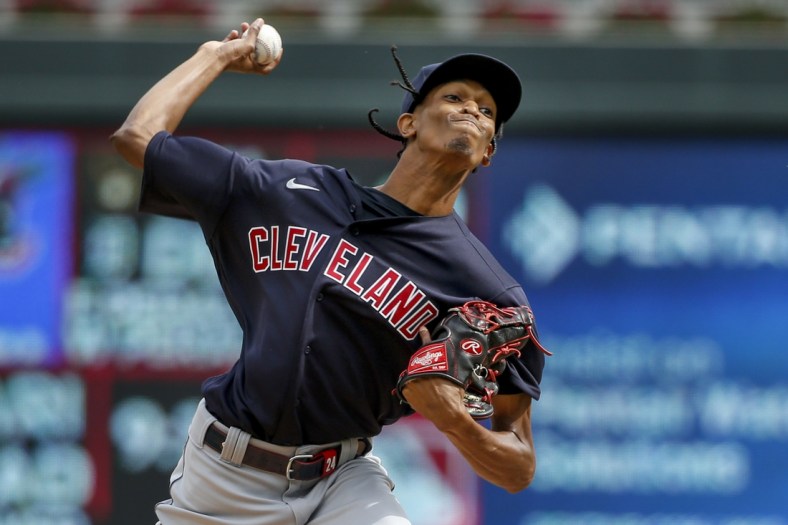 Sep 14, 2021; Minneapolis, Minnesota, USA; Cleveland Indians starting pitcher Triston McKenzie (24) throws to the Minnesota Twins in the second inning at Target Field. Mandatory Credit: Bruce Kluckhohn-USA TODAY Sports