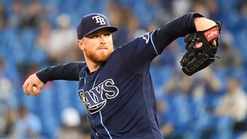 Sep 14, 2021; Toronto, Ontario, CAN; Tampa Bay Rays starting pitcher Drew Rasmussen (57) delivers against the Toronto Blue Jays in the first inning at Rogers Centre. Mandatory Credit: Dan Hamilton-USA TODAY Sports