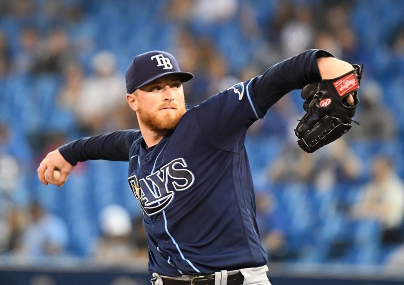 Sep 14, 2021; Toronto, Ontario, CAN; Tampa Bay Rays starting pitcher Drew Rasmussen (57) delivers against the Toronto Blue Jays in the first inning at Rogers Centre. Mandatory Credit: Dan Hamilton-USA TODAY Sports